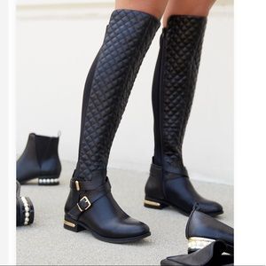 Black quilted thigh high flat boots. New With Tags. Size 11